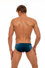 Marcuse Burleigh swim brief in navy stretch velvet with red external drawstring.
