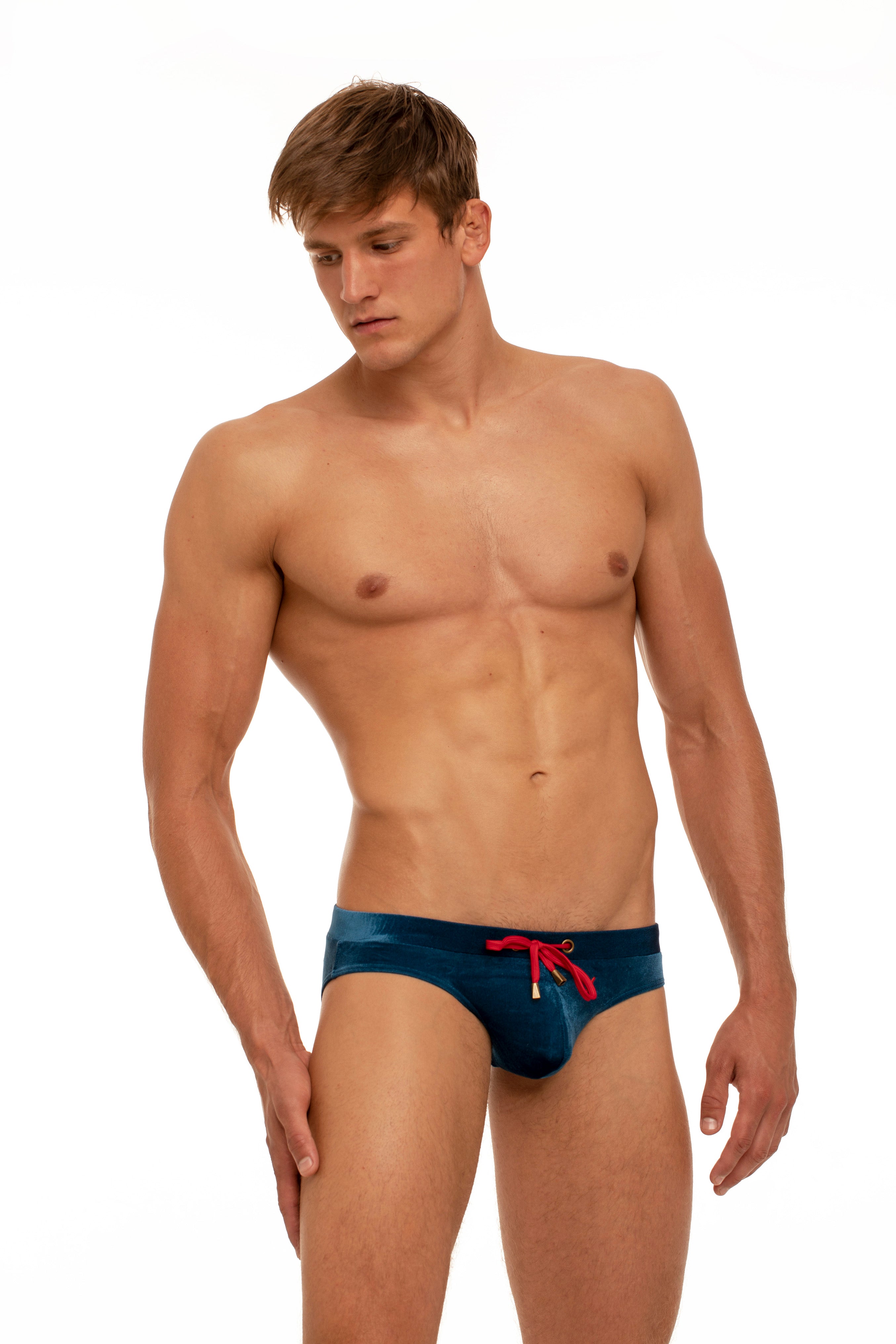 Marcuse Burleigh swim brief in navy stretch velvet with red external drawstring.